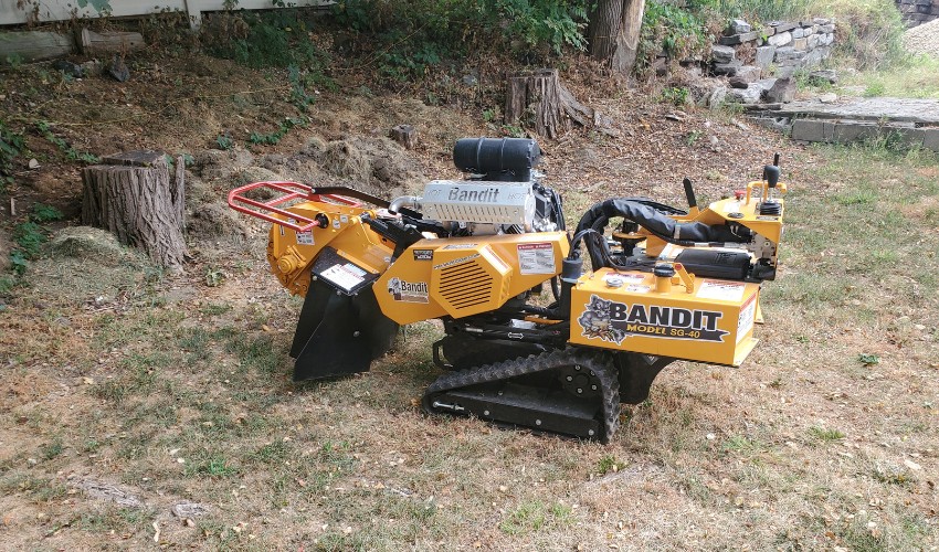 The Hill Treekeepers stump grinder sitting in a yard during a job in Newburgh, NY.